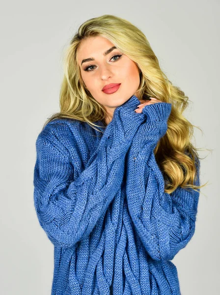 pretty woman with blond curly hair. beauty and fashion. sexy girl in knitted cardigan. lady in casual style. fashionable facial cosmetics for makeup. hairdresser for female. be in trend. Seducing you