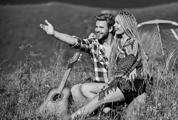 Love concept. Camping vacation. Camping in mountains. Family travel. Hiking romance. Summer vacation. Boyfriend girlfriend guitar near camping tent. Couple in love happy relaxing nature background