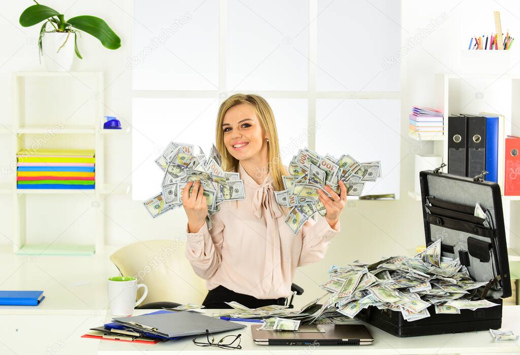Business challenge. Accounting and banking. Smart blonde earn lot of money. Financial success. Tax service. Financial achievement. Financial expert. Girl with briefcase full of cash. Money laundering