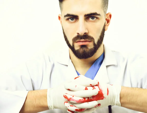 Médico en guantes de látex con barba y expresión facial segura —  Fotos de Stock