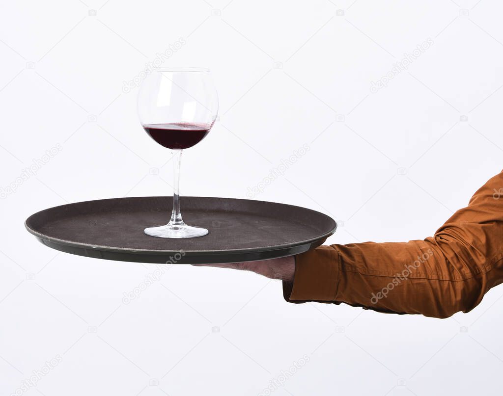 Waiter serves alcoholic beverage on white background