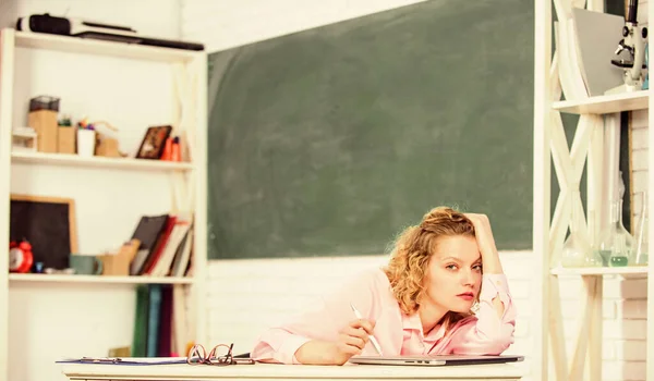 Tired tutor fall asleep at workplace. Tired student lean on desk. Woman tired in school classroom. School pedagogue stressful occupation. Exhausting lesson. Teacher exhausted after hard working day — Stock Photo, Image