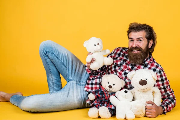 Good mood. Birthday holiday party celebration. feel happiness. Man with beard hold cute toy bear. Man holds teddy bear. Gifts and holidays concept. This is for you. hipster like animal toy — Stock Photo, Image