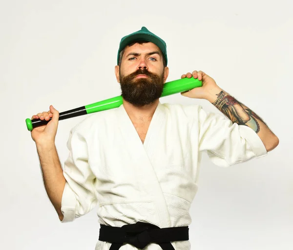 Man with beard in kimono and green cap on white — Stock Photo, Image