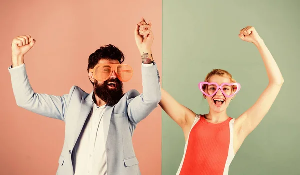Corporate culture. Diving into celebration. Playful businessman and colleague celebrating. Celebrating holiday. Bearded man pretty woman party goggles celebrating. Couple having fun. Office party
