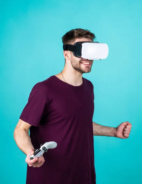 In my virtual world. Digital future and innovation. Visual reality. man wear wireless VR glasses. guy play video games. game player with console. male in VR headset. Happy gamer use modern technology