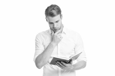 İlginç düşünceler. İş adamı kitabı tutuyor. Kitap okuyorum. Kitaptan ilham al. Ders notları olan üniversite erkek öğrencisi. Kendi kendine eğitim. Çalışmaya devam. Bilgi susuzluğu. Üniversite öğrencisi