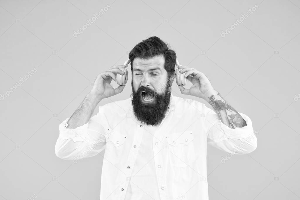 Hearing problem. Bearded man headphones. Active Noise Cancellation Technology. Hipster listen music stereo headphones. Modern wireless headphones. Dance music tracks. Ears health. Loud music