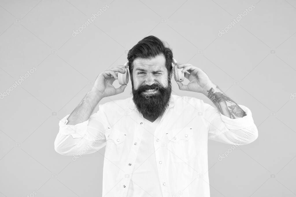 Ears health. Loud music. Hearing problem. Bearded man headphones. Active Noise Cancellation Technology. Hipster listen music stereo headphones. Modern wireless headphones. Dance music tracks
