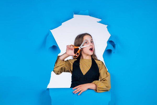 kid use scissors tool in beauty salon. fashion of hairdo. child cut long brunette hair. hair care and health. hairdresser. teen girl cut her hair with scissors. making new hairstyle. I am what I am