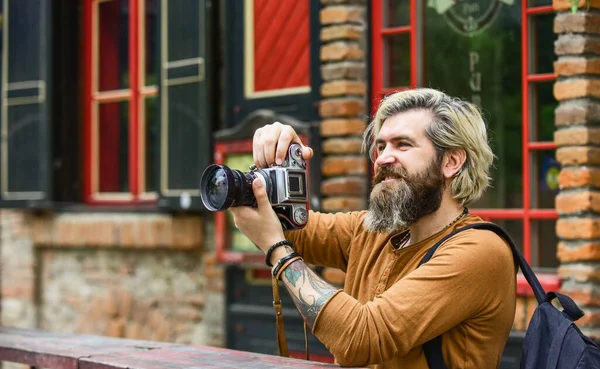 Modern business. Journalist reporter. Brutal stylish man with retro camera. Old technology. Professional photographer use vintage camera. Photography business. Bearded man hipster take photo — Stock Photo, Image