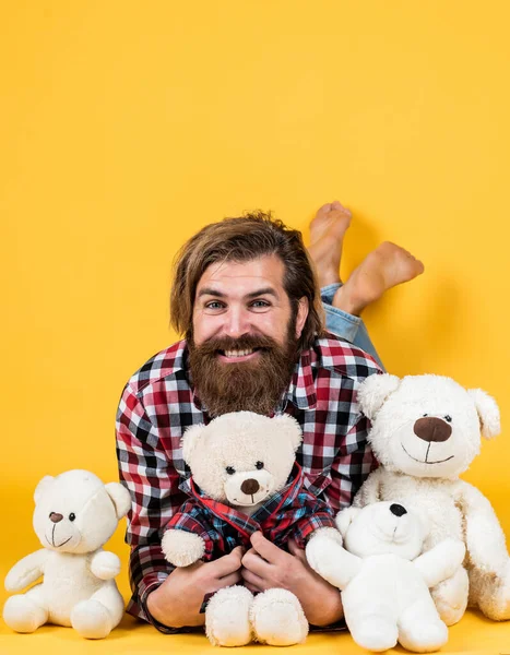 Gift for her. Valentines day gift for beloved. Holiday celebration concept. Guy with happy face plays with soft toy. Childish mood concept. guy enjoy valentines day. best present ever — Stock Photo, Image