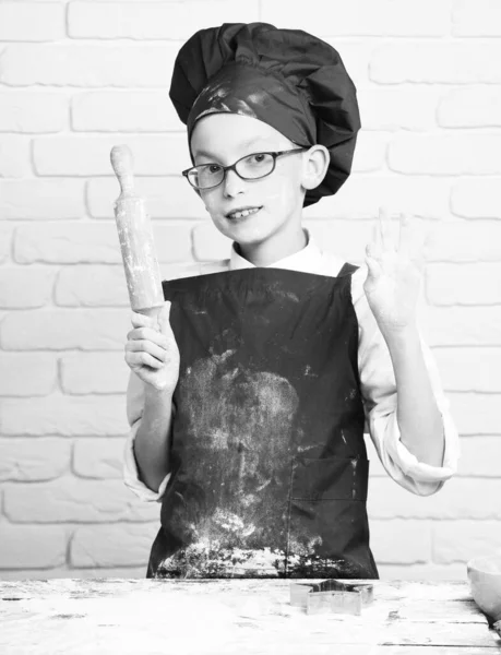 Stained cute cook chef boy on white brick wall background — Stock Photo, Image