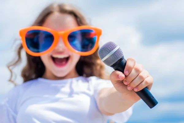 Kid sing with mic. cheerful event manager. child have fun on party. happy singer with microphone. girl singing. vocal school concept. karaoke club. music is my life. Everyone needs good music — Stock Photo, Image