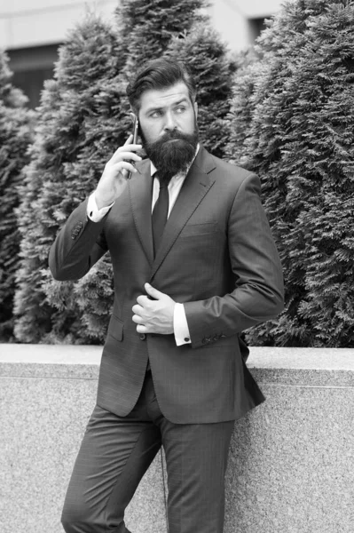 Business communication. Mobile technology. Business call. Stylish guy wear tuxedo. Stay connected. Businessman talk mobile phone. Handsome bearded man with cell phone outdoor. Mobile lifestyle — Stock Photo, Image