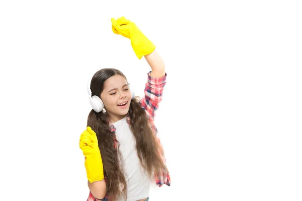 Listening to music while cleaning. little household having fun. ready for home cleaning. motivating playlist. small girl doing housework and chores. having fun during housekeeping tasks. copy space — Stock Photo, Image