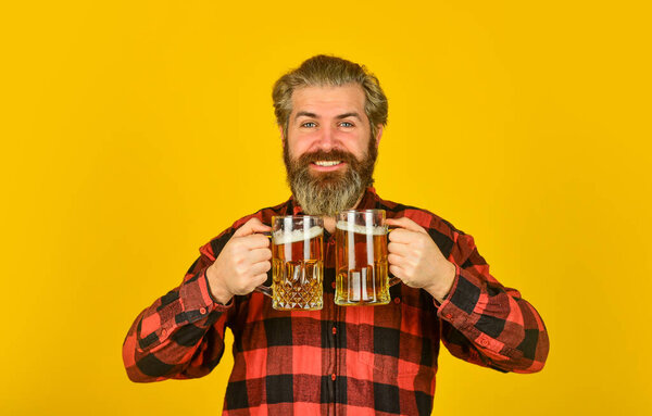Brewing the best beer. Cheers. sport bar. trying a new beer. brutal hipster drink beer. mature bearded man hold beer glass. mug of alcohol beverage. confident bartender. barman in bar. resting at pub
