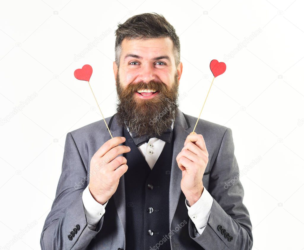Mature man with long beard and cheerful face.