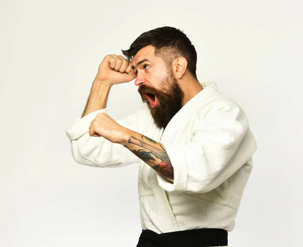 Karate man with raging face in uniform. — Stock Photo, Image