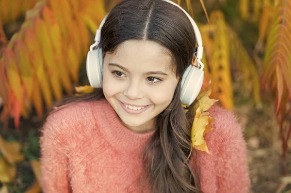 Audio file. Educational podcast. Feel joy. Kid girl relaxing near autumn tree with headphones. Music for autumn cozy mood. Listening song. Autumn playlist concept. Enjoy music outdoors fall warm day — Stock Photo, Image