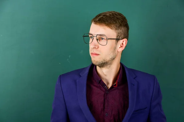 Man teacher wear eyeglasses for vision green chalkboard background, career in education concept — Stock Photo, Image