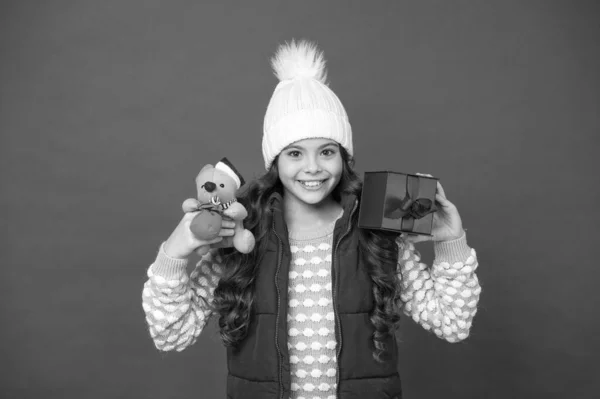 Why not. cute little girl hold mouse toy. child knitted winter clothes play with toy rat. toy shop for kids. christmas gifts online. in xmas mood. happy new 2020 year. mouse symbol of the year