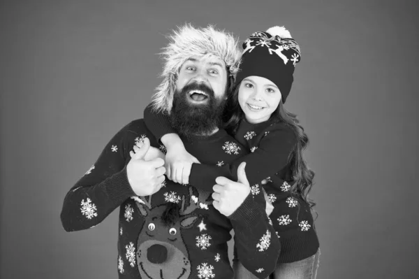 Merry christmas. Family celebrate holiday. Family tradition. Winter holidays. Father daughter winter sweaters celebrate new year. Happy family hug. Bearded man and kid. Best wishes from us with daddy