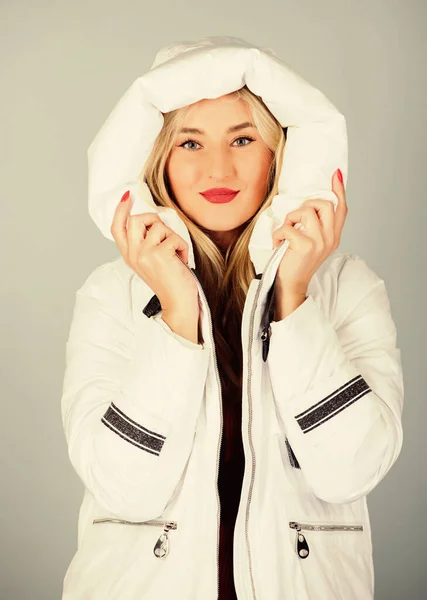 Fancy winter clothes. Not every jacket is ideal for every climate. Girl wear white jacket. Jacket has extra insulation and slightly longer fit in order to protect your body from sharp winter weather