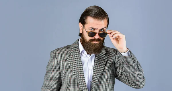 handsome man wear office suit. male beauty and fashion. brutal businessman with perfect beard and moustache. real boss in jacket. mature man wear glasses. confidence and charisma. Young expertise