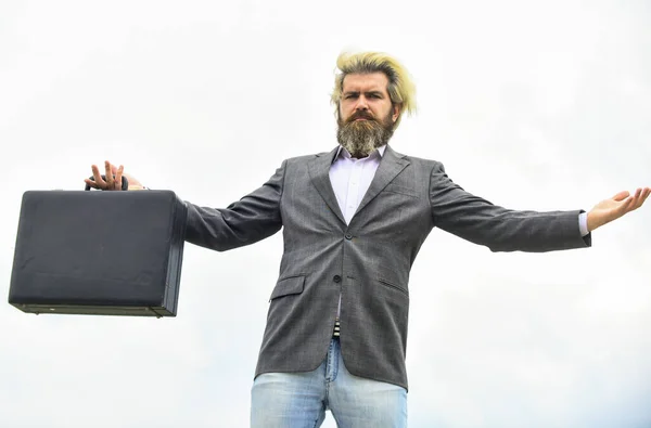 Business concept. bag with money. happy and successful man hold money case. bearded man show office briefcase. good business deal. successful business concept. rich man with beard. live in luxury