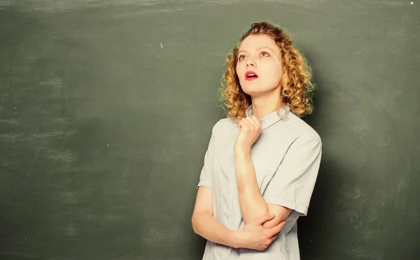 Teacher best friend of learners. Good teacher is master of simplification. Passionate about knowledge. Teaching could be more fun. Woman teacher in front of chalkboard. Teacher explain hard topic