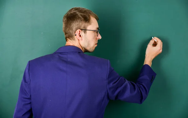 Back to school. university teacher write on blackboard. student study in college. modern education concept. young but skilled businessman. typical office worker. man wear glasses and jacket — Stock Photo, Image