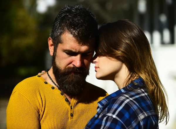 Girl and bearded guy or happy lovers on date hug — Stock Photo, Image