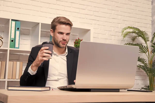 Starting own business. Ceo head office concept. Business development. Businessman drinking coffee. Confident man use laptop. Handsome man in business office. Inspired with cup of fresh coffee