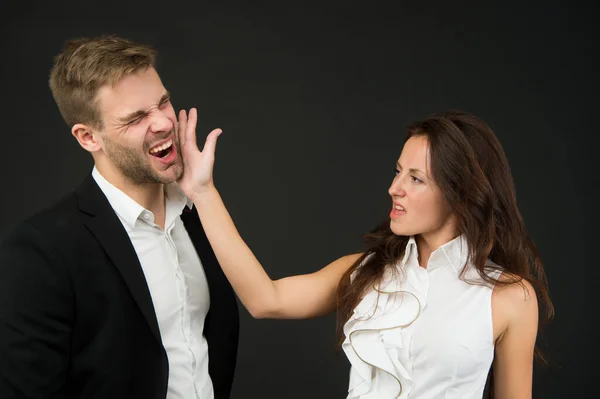 Abuse at work. Angry woman slap man in face. Using physical abuse in workplace. Physical harm. Coworker harassment and discrimination. Bullying and violence. Occupational injury. Victim protection