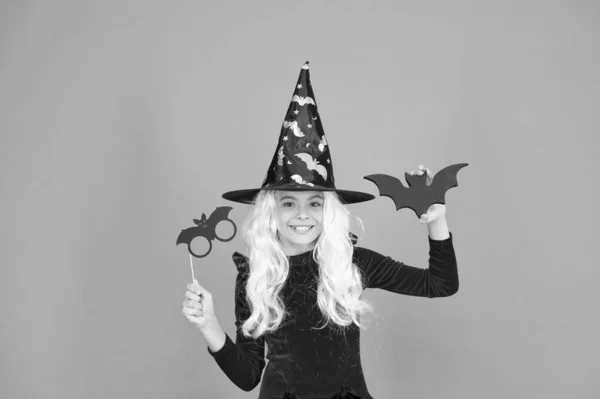 Curse spell. Little girl cast magic spell orange background. Wicked witch spell. Magic and witchcraft with spell and incantation. Holiday celebration. Halloween party fun. Witchery. Magical skills — Stock Photo, Image