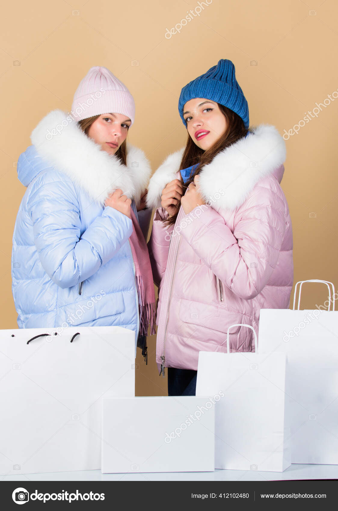 Faux fur. Girls wear warm jackets. Shopping concept. Shopping bags. Having  fun together. Black friday. Buy winter clothes. Sale and discount. Women  friends shopping winter clothes. Shopping guide Stock Photo by ©stetsik