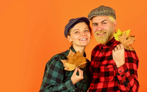 Autumn leaves. Farmer family concept. Autumn is coming to our village. Farmers market. Autumn mood. Couple in love checkered rustic outfit. Retro style. Cheerful smiling couple dating. Fall season