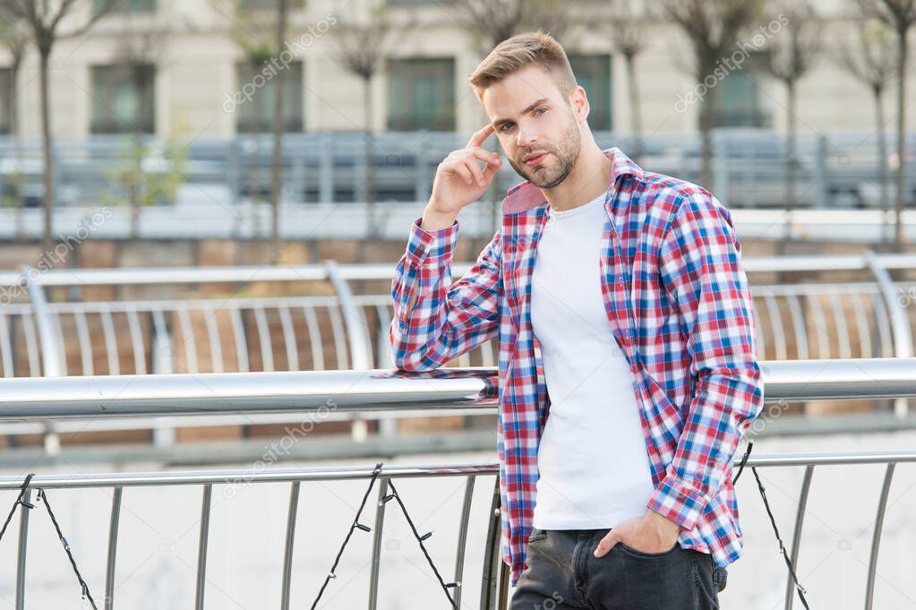 Modern man. Caucasian male resting in street. modern life concept. Young man in checkered shirt. businessman standing outdoor. smart casual dressed person relax in city outdoor. copy space