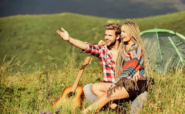 Passionate love. friendship. campfire songs. men play guitar for girl. happy friends with guitar. couple in love spend free time together. country music. romantic date. western camping. hiking — Stock Photo, Image