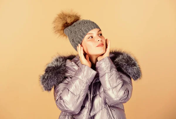 Merry Christmas. woman in padded warm coat. flu and cold. seasonal fashion. girl in beanie hat. faux fur fashion. happy winter holidays. New year. beauty in winter clothing. cold season shopping