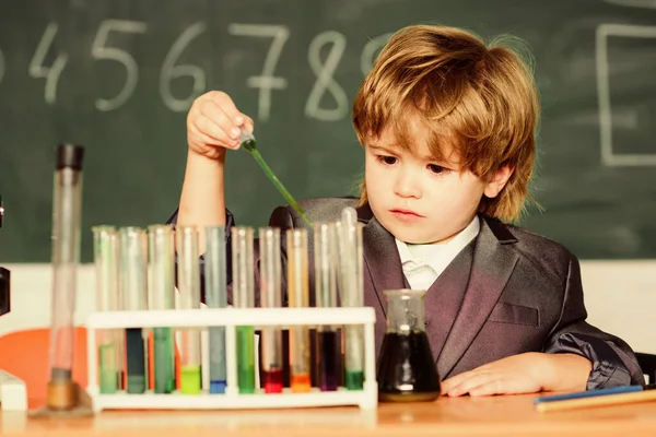 Little boy at lesson. Back to school. biology science. science experiments in lab. Little boy is making science experiments. school kid scientist studying science. Confident pharmacist — Stock Photo, Image