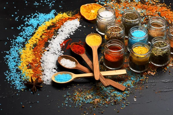 Set of spices on grey background. Composition of colored salt — Stock Photo, Image