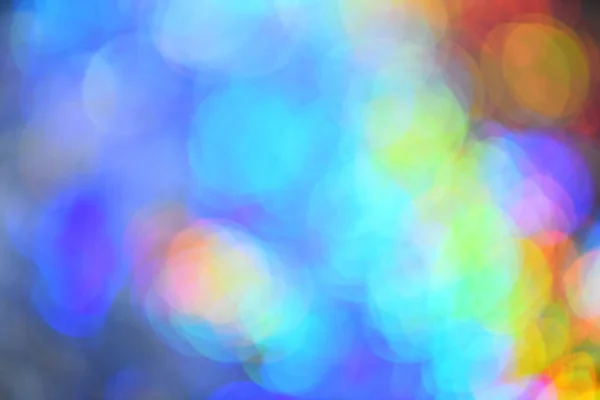Bakgrund med färgglada ljus. Julbelysning av alla regnbågens färger — Stockfoto