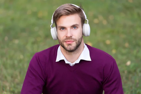 Education with ebook. man with bristle in headset listening music while relax in park. guy learning with audio book. get useful information. man enjoy song. students life — Stock Photo, Image