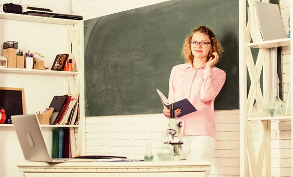 Girl adorable teacher in classroom. Educational process concept. Educational program for primary school. Educational methods include storytelling discussion teaching training and directed research