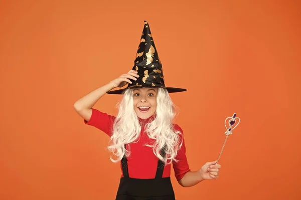 This is so much fun. small child witch hat. trick or treat. supernatural charmer. kid enchantress wave magic wand. happy halloween. believe in magic. girl halloween party. mystery witch do magic — Stock Photo, Image