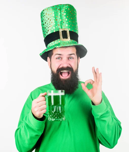 Drinking beer part celebration. Bar seasonal holiday menu. Alcohol consumption integral part saint patricks day. Irish tradition. Man brutal bearded hipster drink pint beer. Irish pub. Green beer mug — Stock Photo, Image