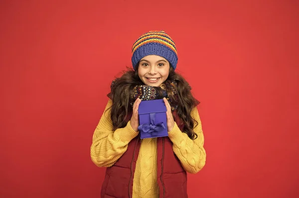 Fashion shop. Cheerful smiling child long hair in stylish outfit. Winter wardrobe. Winter fashion. Hipster fashion trend. Happy winter holidays activity. Feeling warm and happy. Comfy style