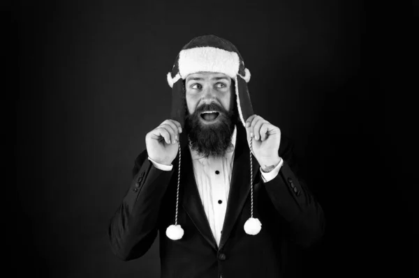 Funny winter hat. Business santa wish you financial growth. Business and corporate. Man hipster style with beard in smart suit and Santa hat. Businessman Santa in jacket. Christmas party concept